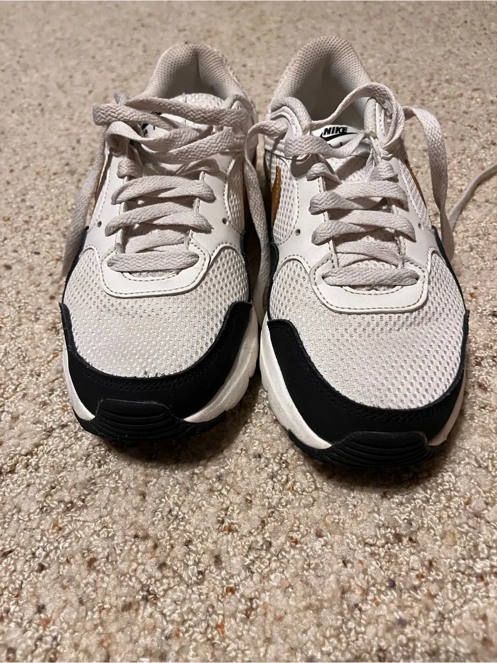Nike White and Black Mesh Sneakers with Gold Swoosh